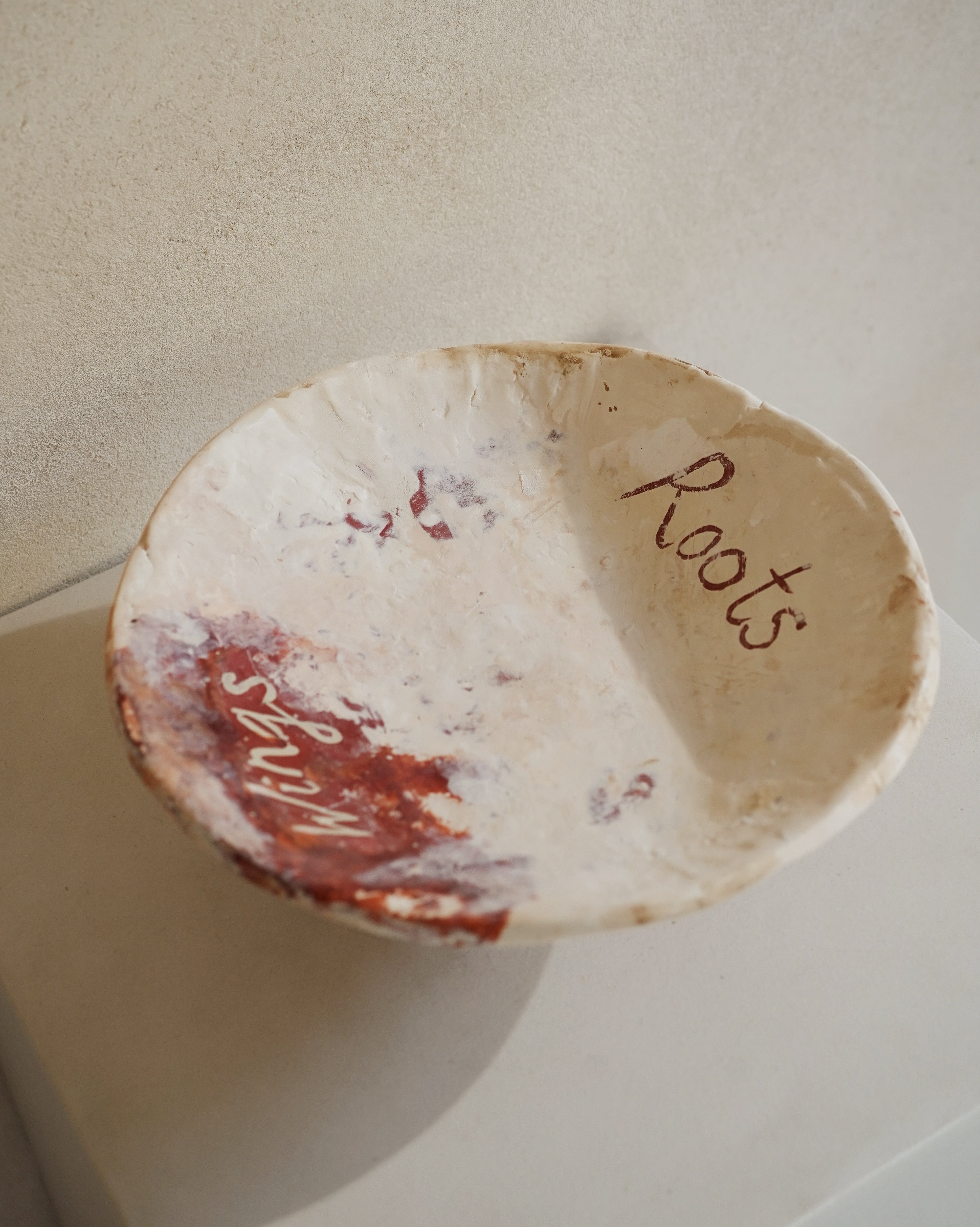 Hand-crafted from natural clays and plaster with drawings of baby rhinos.