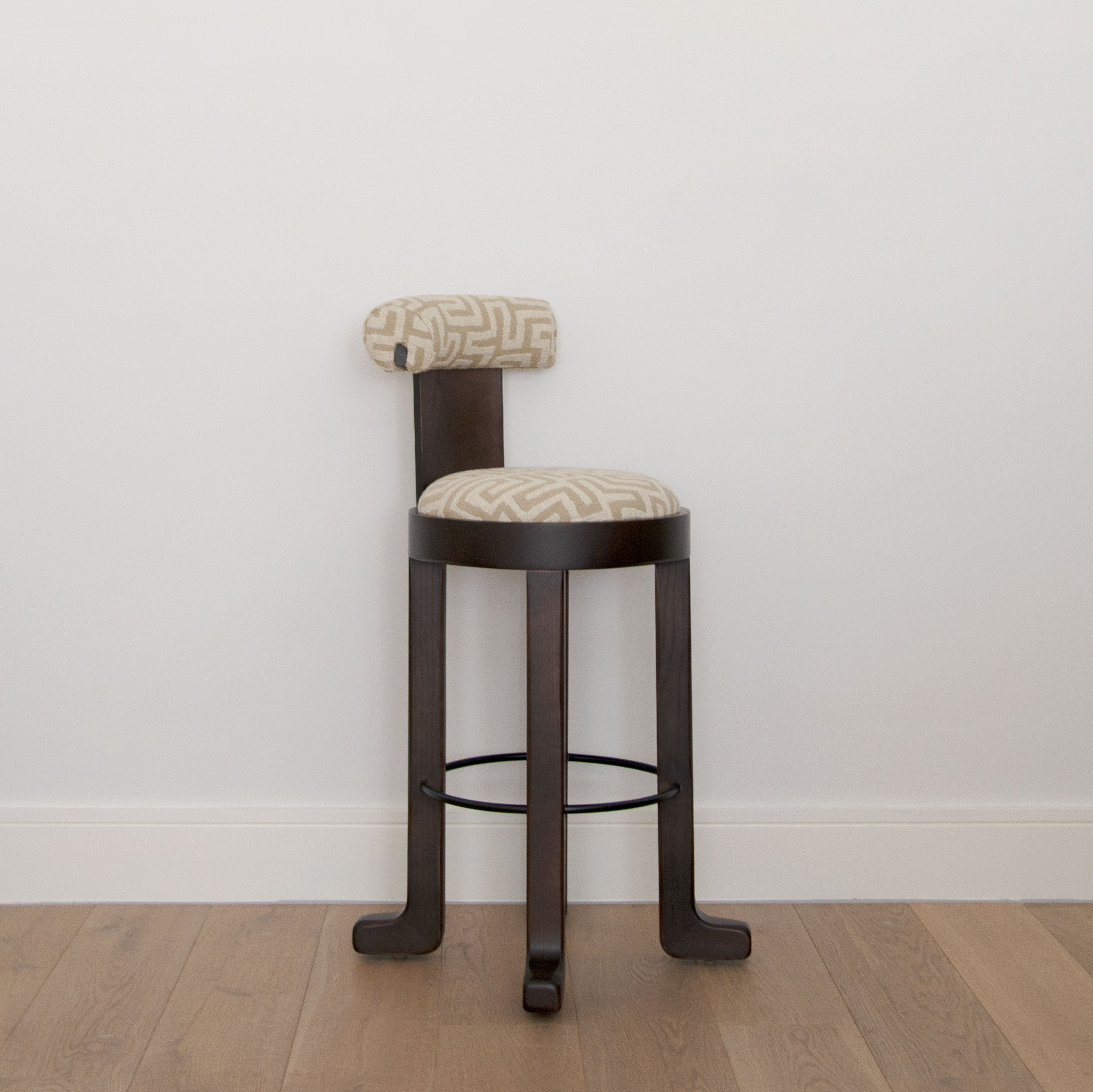 Diagonal view of the Khayni Nya in Cream bar stool