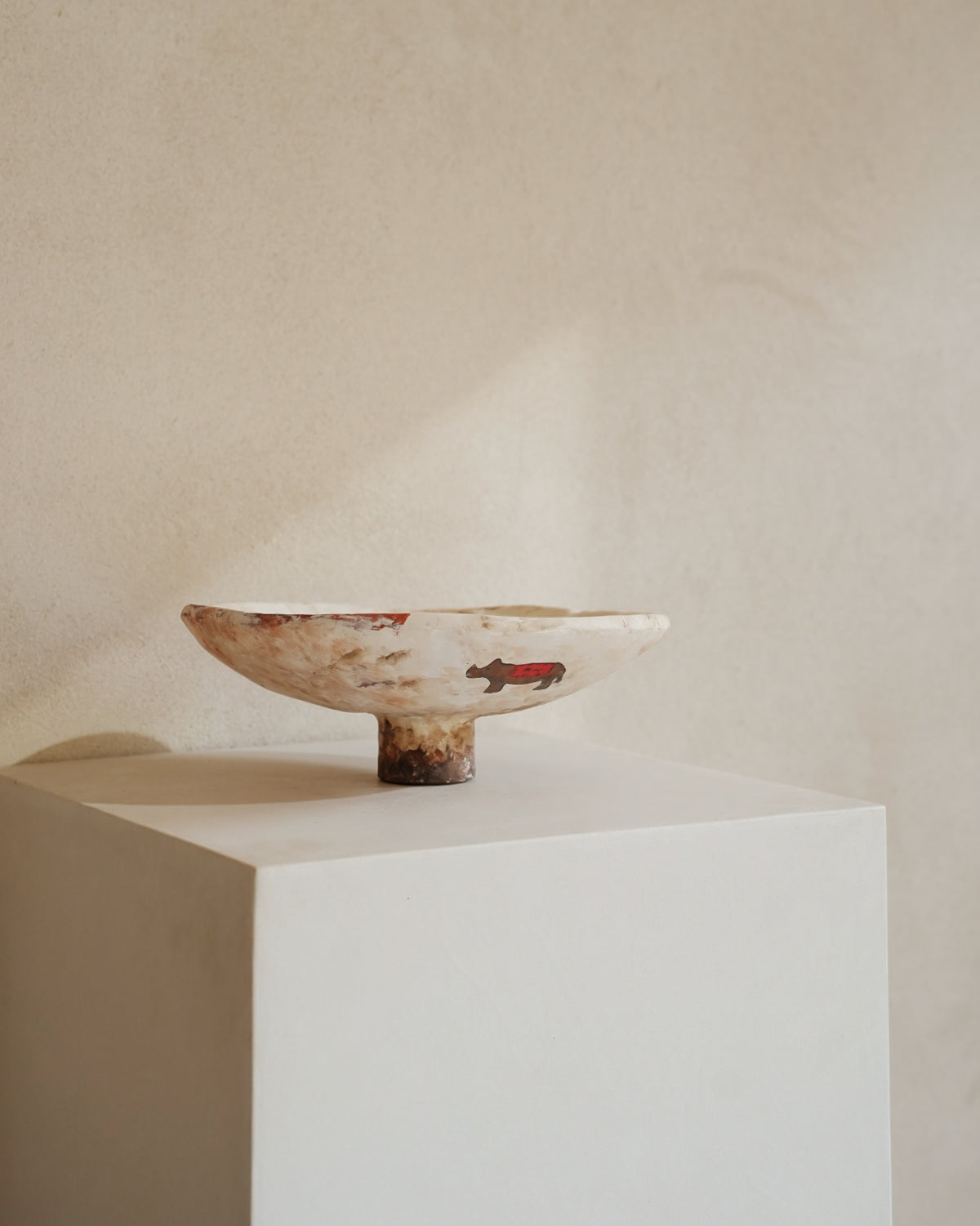 Hand-crafted from natural clays and plaster with drawings of baby rhinos.