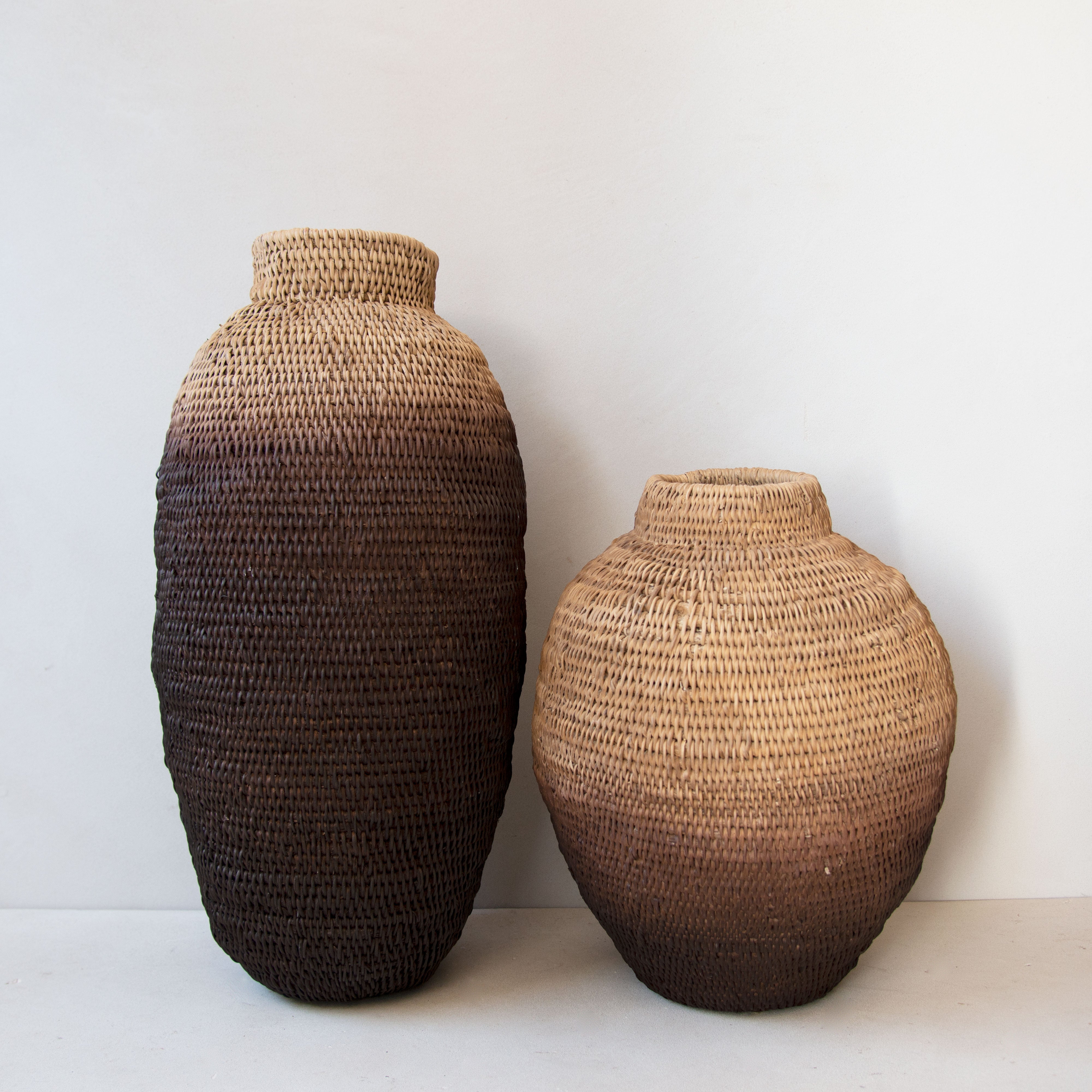 Small ombre Buhera basket next to a large Buhera basket