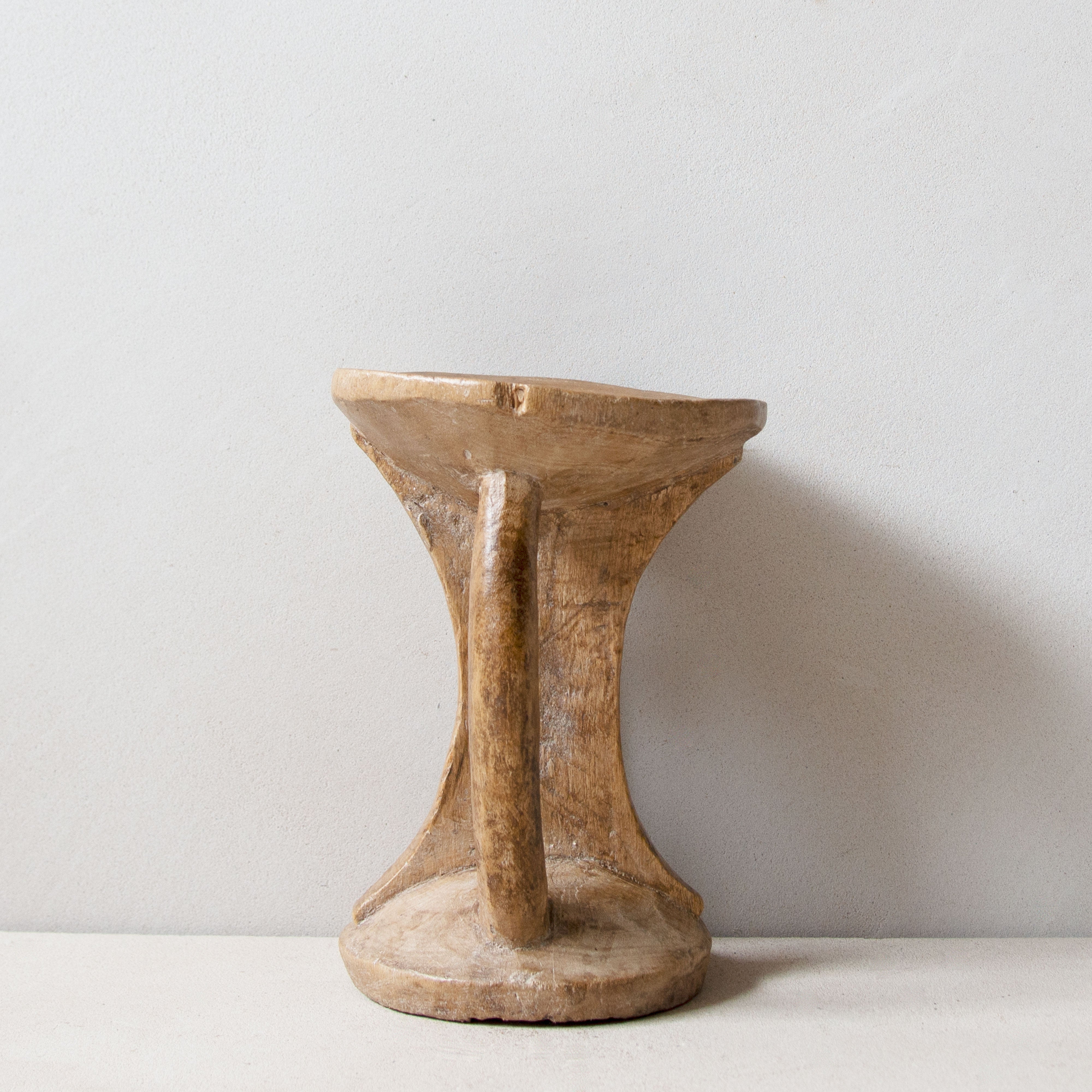 Side view of Khayni's hand-carved Pokot stool No.2