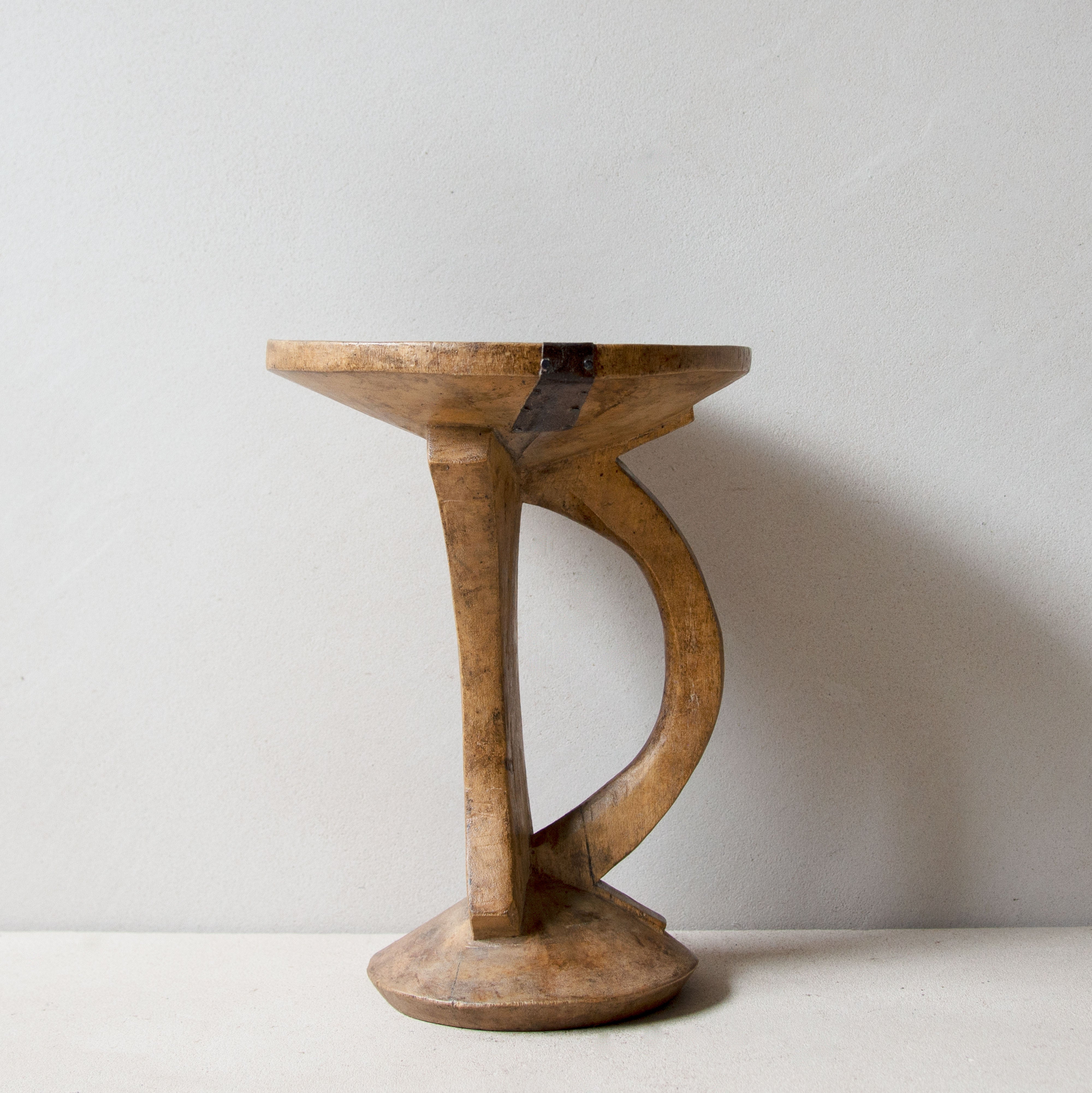Side view of Khayni's hand-carved Pokot stool No.9
